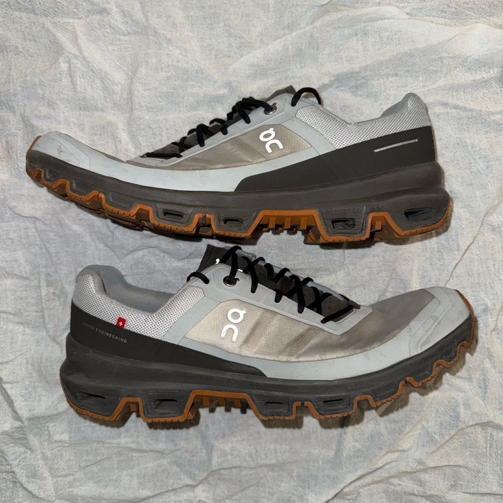 On Running Gray and Black Athletic Shoes with Cloud Cushioning